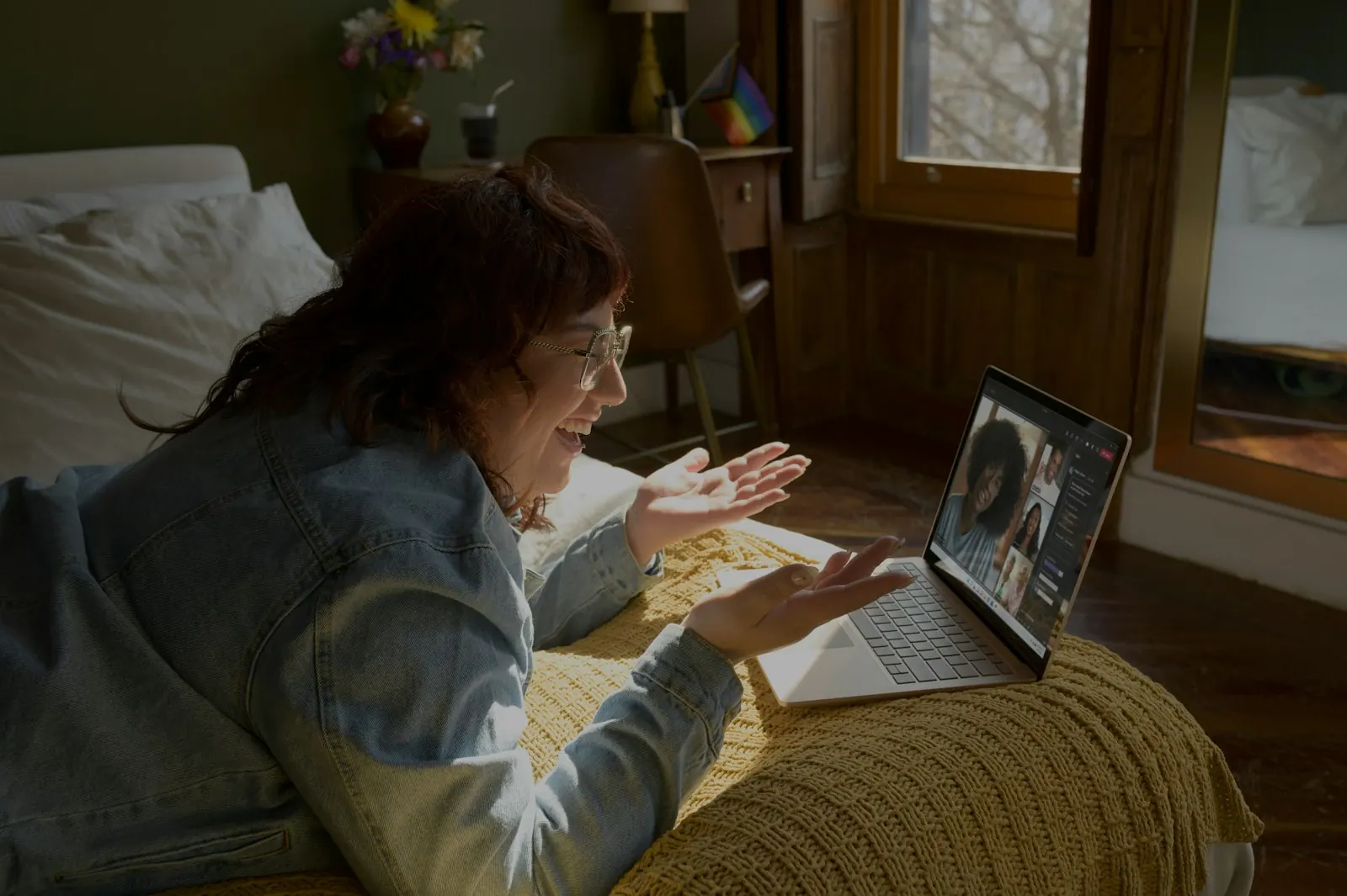Person at home on a laptop video visit — telehealth psychiatry from a private space